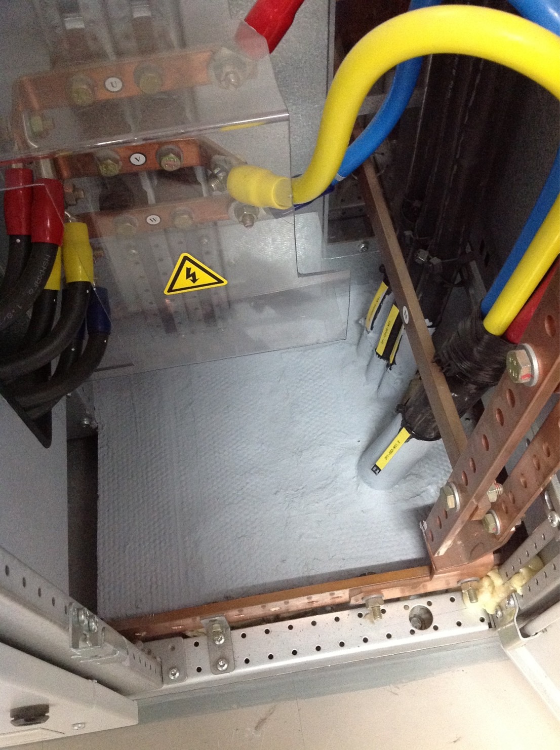 Fire stopping under electrical cabinet